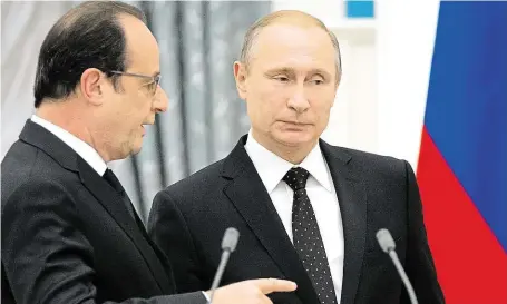  ?? Vladimir Putin a François Hollande si podle diplomatů volají asi dvakrát měsíčně, nálety na Aleppo ale jejich vztahy narušily. Na snímku je jejich setkání v Moskvě z listopadu 2015, kdy jednali o boji s terorem. FOTO ČTK/ AP ?? Sýrie je rozdělila.