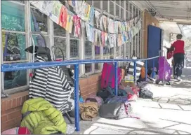  ?? RALPH barrera / american-statesman ?? Many of the classrooms are built around a breezeway. The students keep their belongings and backpacks outside to avoid cluttering the small rooms. An old house on campus holds the middle school classrooms.