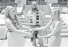  ?? C. TODD SHERMAN, THE (JACKSON, MISS.) CLARION-LEDGER, VIA AP ?? The Rev. Justin McCreary marries Tiffany Brosh, left, and Laurin Locke on June 29 in Jackson, Miss.