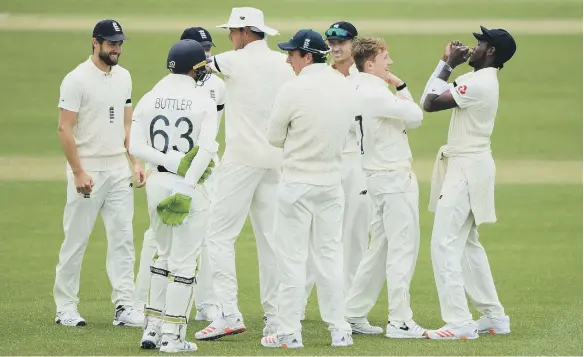  ??  ?? Dominic Bess and Jofra Archer (far right) celebrate by hitting elbows after dismissing Keaton Jennings.