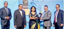  ?? ?? Jiffy Products Managing Director Ruwan Rajapakse (second right) receives one of the NCE awards won by the company from Sampath Bank Senior DGM Shashi Kandambi Jassim