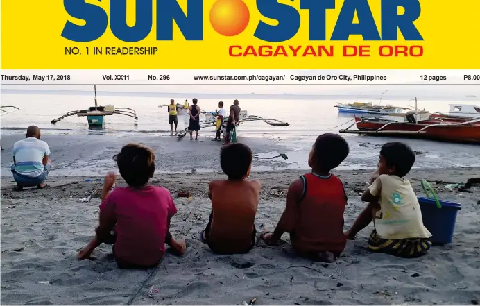  ?? (LYNDE SALGADOS) ?? SURVIVORS. So young as they are, these kids know how to deal better with hard times as they patiently wait for the boats of fishermen to return along the shore of brgy. Bonbon, Cagayan de Oro for the usual `punit’ fest, or the act of emptying the...