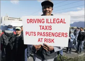  ?? PICTURE: MICHAEL WALKER ?? Police block the entrance to Cape Town Internatio­nal Airport yesterday to stop an illegal protest by cab drivers against taxi operator Uber.