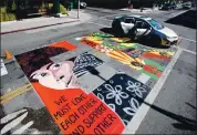  ?? RANDY VAZQUEZ — STAFF PHOTOGRAPH­ER ?? The E on Matter on a Black Lives Matter mural on Hamilton Avenue in Palo Alto on Thursday. The mural depicts Black Liberation Army member Assata Shakur on the E.