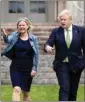  ?? PTI ?? British Prime Minister Boris Johnson, right, and Sweden's Prime Minister Magdalena Andersson take a walk around the gardens, in Harpsund, the country retreat of Swedish prime ministers, Wednesday