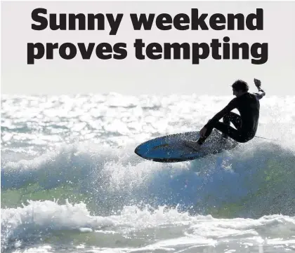  ?? Photo / Michael Cunningham ?? Shayne Maxwell from Tutukaka enjoys a surf on Friday. Surfing is allowed at level 3.