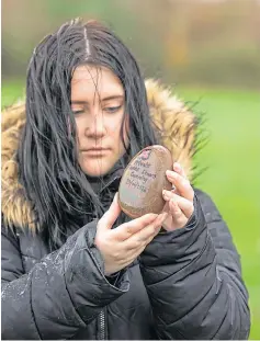  ??  ?? Eilidh Bowen with one of the remembranc­e stones.