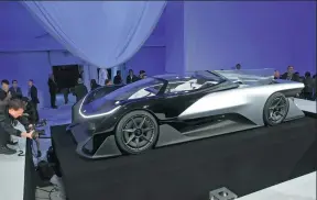  ?? STEVE MARCUS / REUTERS ?? The Faraday Future FFZERO1 electric concept car attracts attention in Las Vegas, Nevada, on Monday.