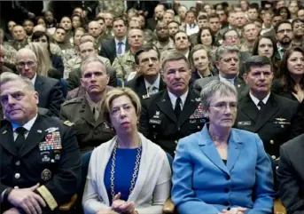  ?? Doug Mills/The New York Times ?? Members of the U.S. Armed Forces and other audience members at the Pentagon listen to an address by President Donald Trump on Thursday in Arlington, Va. Mr. Trump said he would update a decades-old missile defense system to protect the U.S. from emerging threats.