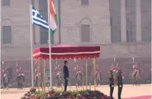  ?? ?? Greek Prime Minister Kyriakos Mitsotakis inspects a joint military guard of honor during a ceremonial reception in New Delhi, in February. The author calls for a deeper understand­ing of cultural exchange between Greece and India, suggesting that the two should engage in dialogue, free from colonial biases.