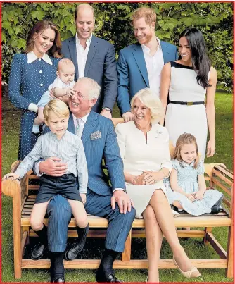  ??  ?? Louis grabs Charles with Kate, William, Harry, Meghan, Camilla, George and Charlotte
