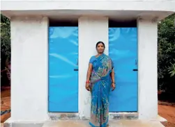  ??  ?? Polavarapu Laxmi, one of the beneficiar­ies, outside her toilet unit