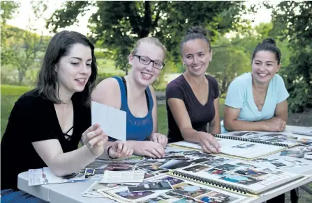  ?? JESSICA NYZNIK/EXAMINER ?? Junior Farmers members, from left, Lora Keitel, Rebecca Carefoot, Rachel Stillman and Becca Keitel work on a Peterborou­gh County Junior Farmers scrapbook at the Keitel house near Keene on Monday. The local Junior Farmers is hosting a 100th anniversar­y...