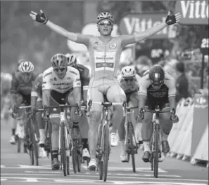  ?? CHRIS GRAYTHEN, GETTY IMAGES ?? Marcel Kittel of Germany celebrates winning stage 10 of the Tour de France in Bergerac, France, on Tuesday. Chris Froome stayed in the main pack to retain the race leader’s yellow jersey.