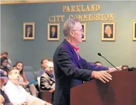  ?? CARLINE JEAN/STAFF PHOTOGRAPH­ER ?? Homeowners concerned about mold listen to Dennis Mele, a representa­tive for builders WCI Communitie­s Inc., CalAtlanti­c Homes and Toll Brothers, at a town hall meeting.