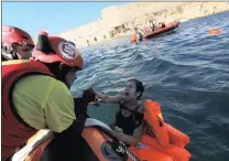  ?? PICTURE: REUTERS ?? Lifeguards from the non-government­al organisati­on Proactiva Open Arms conduct a rescue drill at Valletta, Malta