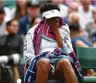  ?? Clive Brunskill / Getty Images ?? Williams attempts to console herself after losing to Gauff, who is 24 years younger than Williams.