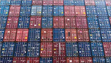  ?? MELINA MARA / THE WASHINGTON POST ?? TRAC Intermodal containers stand stacked in Long Beach. Just as the material supply chain has been disrupted during the pandemic, so has our supply chain of faith.