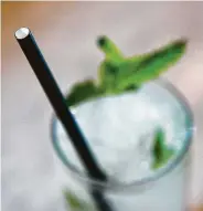  ?? Mark Mulligan / Houston Chronicle ?? Liberty Kitchen &amp; Oysterette is using paper straws instead of plastic for drinks, including cocktails.