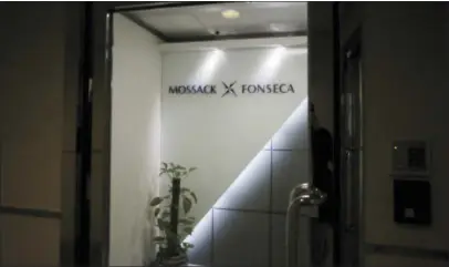  ?? VINCENT YU — THE ASSOCIATED PRESS ?? This file photo shows the entrance of the regional head office of Panama-based law firm Mossack Fonseca, one of the world’s biggest creators of shell companies, in Hong Kong, America’s openness to foreign tax evaders is coming under new scrutiny after...