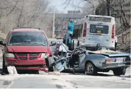  ?? ALLEN McINNIS ?? The driver of a car that collided head-on with an STM bus, which is being towed away, above, was critically injured on Thursday. He is in critical condition in hospital.
