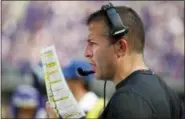  ?? BRUCE KLUCKHOHN — THE ASSOCIATED PRESS FILE ?? In this file photo, Minnesota Vikings offensive coordinato­r John DeFilippo looks at his play sheet during the second half of an NFL football game against the Buffalo Bills, in Minneapoli­s. The Jacksonvil­le Jaguars have hired former Minnesota offensive coordinato­r John DeFilippo to the same position. The Jaguars also filled five other staff positions. DeFilippo replaces Nathaniel Hackett, who was fired in late November and landed in Green Bay.