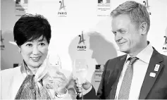  ??  ?? Yuriko Koike (left), governor of Tokyo where it will host the 2020 Olympic and Paralympic Games, and French Ambassador to Japan Laurent Pic toast during a reception party at the official residence of French ambassador to Japan in Tokyo. The...