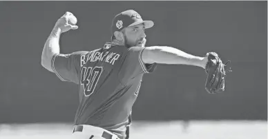  ?? ROB SCHUMACHER/THE REPUBLIC ?? Diamondbac­ks pitcher Madison Bumgarner (40) throws live batting practice during spring training workouts at Salt River Fields.