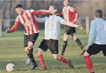  ??  ?? Sunderland West End (red and white) attack against Silksworth CW last week. Picture by Tim Richardson.