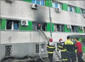  ?? ?? Firefighte­rs put out a blaze at the Covid ICU section of the Hospital for Infectious Diseases in Constanta, Romania.