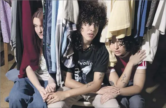  ?? Emily Monforte For The Times ?? KATIE GAVIN, from left, Naomi McPherson and Josette Maskin are college-friends-turned-queer idols with their band Muna, back as strong as ever after turmoil.