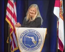  ?? DAMON HIGGINS / THE PALM BEACH POST ?? Wellington Mayor Anne Gerwig speaks to Palm Beach County League of Cities meeting at the Kravis Center before being installed as the group’s new president Wednesday.