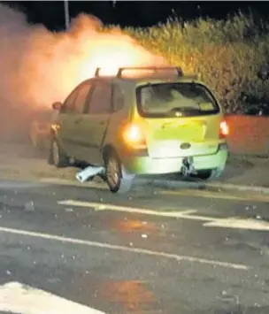  ??  ?? ●●A people carrier caught fire after crashing into a speed camera following a pursuit by police in Rochdale