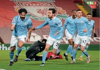  ??  ?? Reclaiming the title?…Manchester City celebrate their big win at Anfield