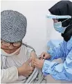  ?? | Reuters ?? A MAN receives a vaccine against Covid-19 in Benghazi, Libya, one of a number of African countries where less than 0.1% of people have been vaccinated.