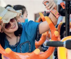  ?? ?? A tourist takes a selfie at Tanhualin Resort in Wuhan, Hubei Province, in October 2021