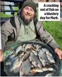  ?? ?? A cracking net of fish on a blustery day for Mark.
