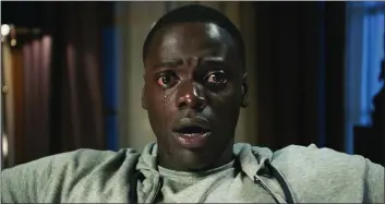  ?? BLUMHOUSE PRODUCTION­S ?? Daniel Kaluuya learns his girlfriend’s parents have sinister motives in the horror-thriller “Get Out.”