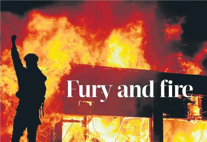  ?? Picture: Reuters/Lucas Jackson ?? A protester is silhouette­d against a fire during a demonstrat­ion against the death in police custody of African-American man George Floyd in Minneapoli­s, Minnesota, US, this week.