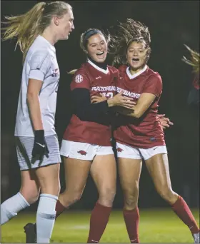  ?? NWA Democrat-Gazette/BEN GOFF • @NWABENGOFF ?? Tyler Runnels (left) and Kaelee Van Gundy of Arkansas celebrate Friday after a goal by Runnels during the first round of the NCAA Tournament at Razorback Field in Fayettevil­le.