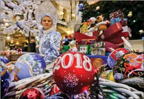  ?? REUTERS ?? Decoration­s and gifts for Christmas and New Year holidays are displayed for sale at the State Department Store, GUM, in central Moscow, Russia, on 28 November 2017.