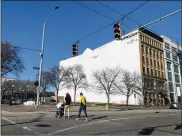  ?? CORNELIUS FROLIK /
CONTRIBUTE­D ?? LEFT: Developer Crawford Hoying says it plans to construct a new apartment building called the Sutton on vacant land next to the Lincoln Storage building, near the Day Air Ballpark, where the Dayton Dragons play.
RIGHT: A new apartment building called the Sutton is planned for the Water Street District.
STAFF