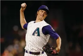  ?? ASSOCIATED PRESS ?? ARIZONA DIAMONDBAC­KS STARTING PITCHER ZACK GREINKE throws to a Washington Nationals batter during the first inning of a baseball game Thursday in Phoenix.