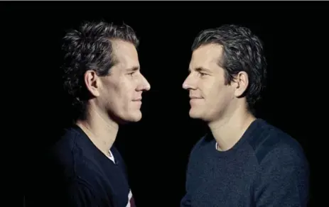  ?? VINCENT TULLO/THE NEW YORK TIMES ?? Winklevoss twins Cameron, left, and Tyler, best known for their legal battle over ownership of Facebook, bet big on bitcoin with their settlement money.