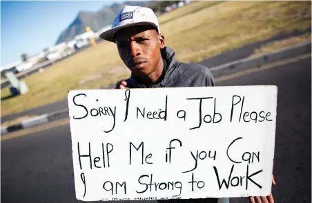  ?? PICTURE: EPA ?? LET ME WORK: An unemployed man offers his services at a traffic intersecti­on in Cape Town. Global economics research group Trading Economics says the unemployme­nt rate across three African countries is 3.8% in Liberia 5.3% in the Ivory Coast and 26.6% in South Africa.