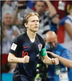 ?? Photo — AFP ?? Luka Modric celebrates after scoring his penalty in the shoot-out win over Russia.