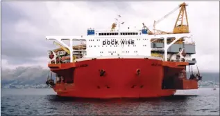  ??  ?? HEAVYLIFT: Above left: Dockwise’s heavylift ship Blue Marlin off Glencairn in 2005. The south-easter thwarted attempts to float off her cargo of oil platforms.