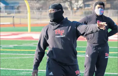  ?? PHOTOS BY GARY MIDDENDORF / DAILY SOUTHTOWN ?? Homewood-Flossmoor linebacker Malyk Jones explains a drill during the first official day of practice in Flossmoor on Wednesday.