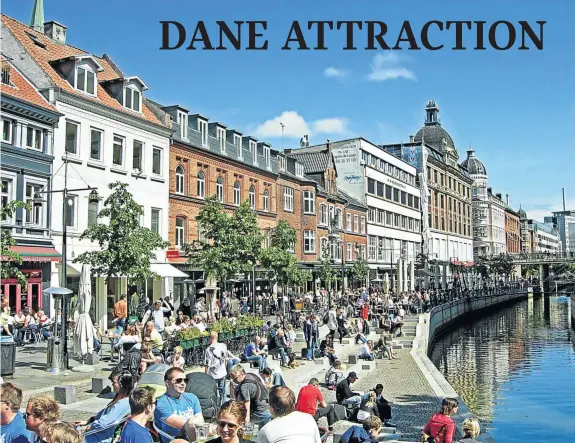  ?? Picture: THINKSTOCK ?? WHET THE APPETITE: Diners beside the Aarhus River, which flows through the centre of Aarhus city, Denmark