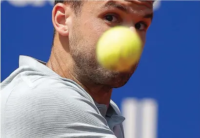  ?? AP ?? Grigor Dimitrov from Bulgaria keeps his eyes on the ball during his match against Malek Jaziri of Tunisia in the Barcelona Open. —